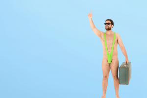 A man who's been subjected to the mankini prank standing in a green mankini