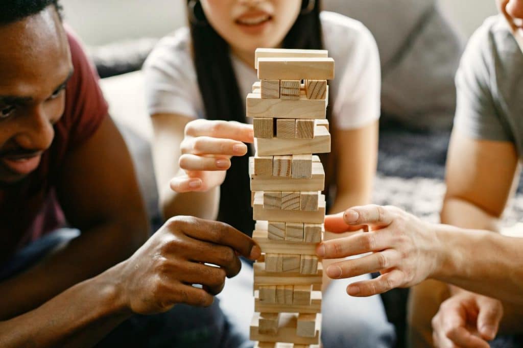 Group playing jenga as part of their sten do ideas