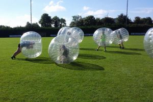 Lads playing bubble football for a stag party after covid