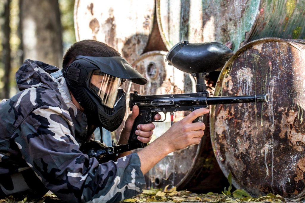 Man playing paintball for a stag party after covid