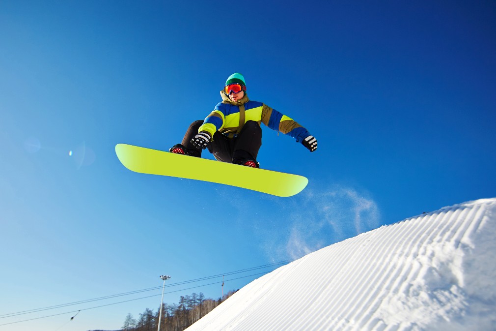 A man snowboarding midair
